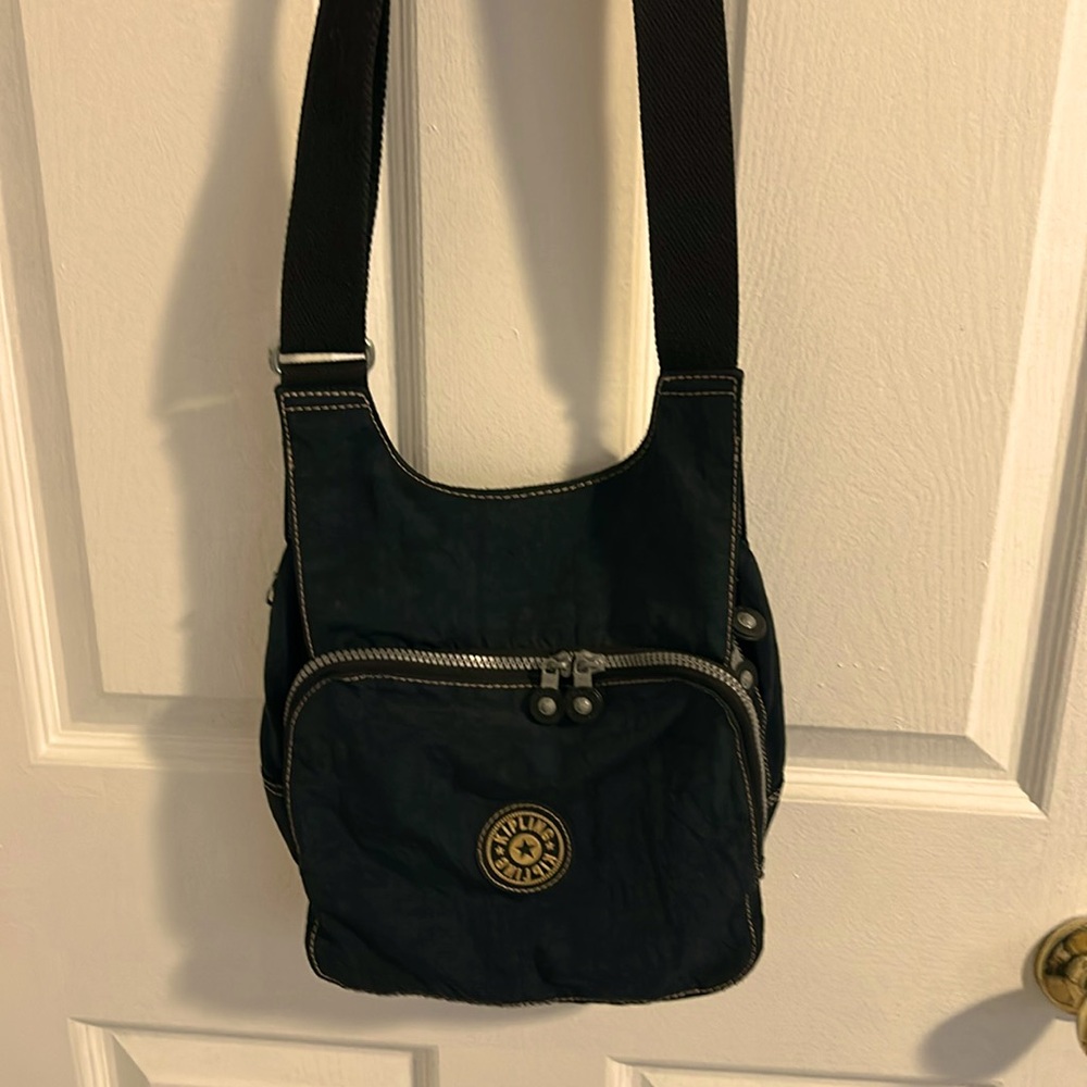 Kipling crossbody adjustable bag. Dark navy blue. Excellent condition.